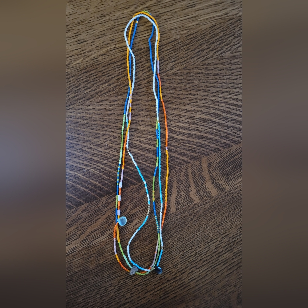 Noisy Plume seed bead strand necklaces.
